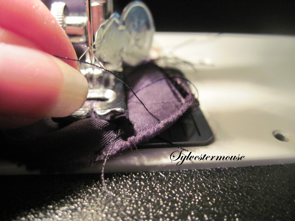 How to thread a sewing machine needle